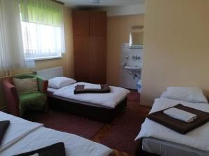 Ein Bett oder Betten in einem Zimmer der Unterkunft Guesthouse Arnika