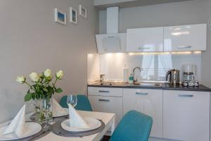 Kuchnia lub aneks kuchenny w obiekcie Ambria Apartments Promenada