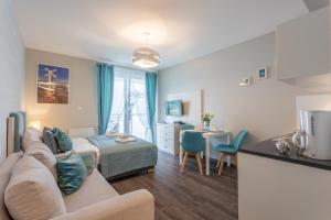Łóżko lub łóżka w pokoju w obiekcie Ambria Apartments Promenada