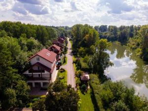 an aerial view of a house next to a river at Eco-hotel Lel' in Ufa