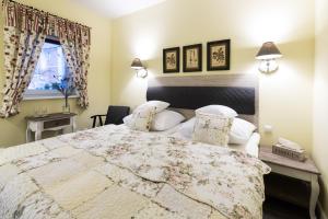Łóżko lub łóżka w pokoju w obiekcie Villa Aurora