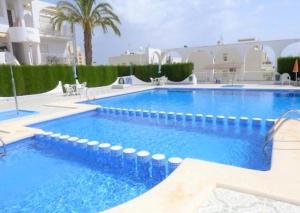 The swimming pool at or close to Apartment with pool & balcony less than 10min walk to La Mata Beach!