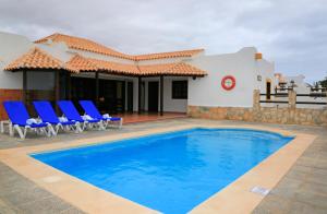 Bazén v ubytování Vip Villas - Caleta Dorada nebo v jeho okolí