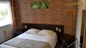 Postel nebo postele na pokoji v ubytování Hotel Au Spatial