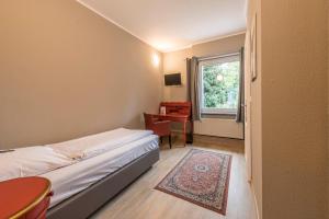Postel nebo postele na pokoji v ubytování Hotel Hiltruper Hof