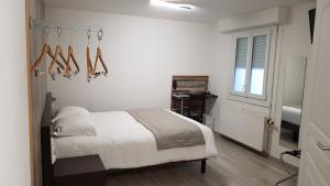 Postel nebo postele na pokoji v ubytování Hotel Au Spatial