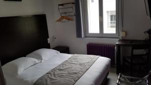 Postel nebo postele na pokoji v ubytování Hotel Au Spatial