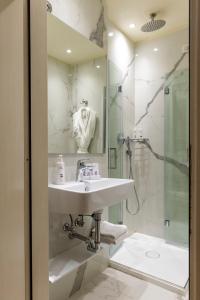 a bathroom with a sink and a shower at Hotel Antico Doge - a Member of Elizabeth Hotel Group in Venice