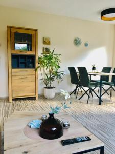 a living room with a vase on a coffee table at Haus Rose in Ribnitz-Damgarten