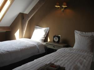 Postel nebo postele na pokoji v ubytování 't Hooghe Licht Bed & Breakfast