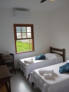 Postel nebo postele na pokoji v ubytování Pousada Cipó Paraty