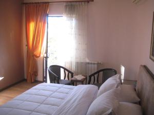 Letto o letti in una camera di Drini Hotel