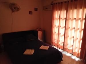 Postel nebo postele na pokoji v ubytování Comfort La Española