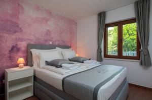 Posteľ alebo postele v izbe v ubytovaní Villa Jasmin + 37 fotografií
