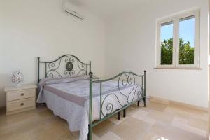 Posteľ alebo postele v izbe v ubytovaní Villa Sorrentino by Perle di Puglia + 37 fotografií