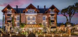 an image of a large house with lights at Hotel Valle Dincanto in Gramado +89 photos