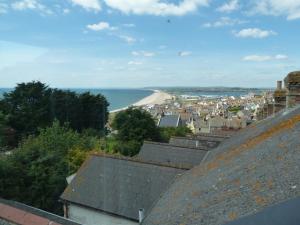 a view of the beach from the roofs of houses at Chesil View House in Portland