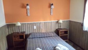 Una cama o camas en una habitación de Hotel Sahara
