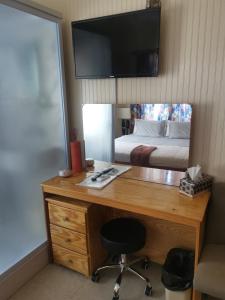 TV a/nebo společenská místnost v ubytování Eko Cozy Guest House