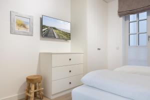 Postel nebo postele na pokoji v ubytování Strandgut Wohnung 5