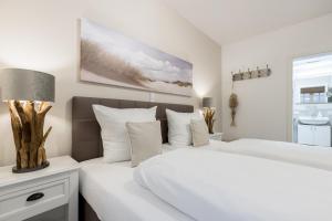 Postel nebo postele na pokoji v ubytování Strandgut Wohnung 5