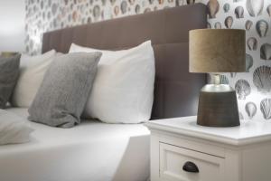 Postel nebo postele na pokoji v ubytování Strandgut Wohnung 5