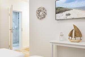 Postel nebo postele na pokoji v ubytování Strandgut Wohnung 5