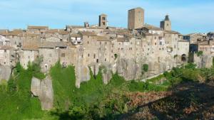 an old castle on top of a mountain at La casa nel Borgo Sospeso "con vasca "no idro " e vista panoramica" in Vitorchiano