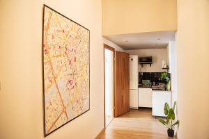 a large map hanging on a wall in a kitchen at Pokoje Stare Miasto in Krakow