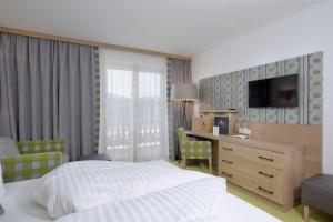 Postel nebo postele na pokoji v ubytování Berghotel Der Königsleitner - Adults only + 37 fotografií