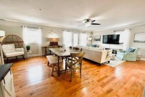 a living room with a table and a couch at Luxurious Ocean View Getaway!! Entire Home! in Jacksonville Beach