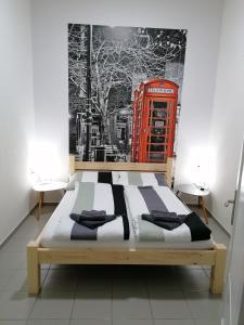 Voodi või voodid majutusasutuse Apartmani Sirmium toas
