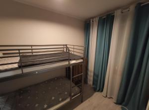 a small room with two bunk beds in it at Apartament przy rynku in Duszniki Zdrój