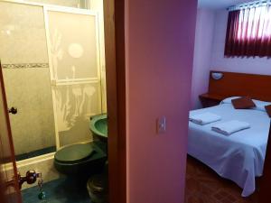 Postel nebo postele na pokoji v ubytování Hostal Sauna Water Palace