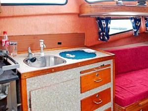 a kitchen with a sink in an rv at 9 person holiday home in HUNDEIDVIK-By Traum in Hundeidvik +59 photos