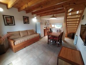 a living room with a couch and a table at Departamentos Lonquimay in Junín de los Andes
