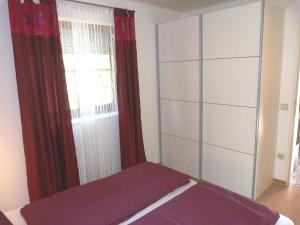 A bed or beds in a room at Ferienhaus Blümel inkl. freier Strandbadeintritt