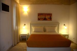 Ένα ή περισσότερα κρεβάτια σε δωμάτιο στο Agriturismo Masseria San Leonardo