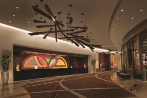 a large room with a large fire place in it at Vdara Hotel & Spa at ARIA Las Vegas in Las Vegas