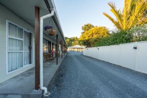 an empty street in front of a building at Sierra Beachfront Motel in Kaikoura