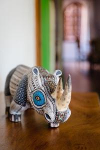 
a toy elephant is sitting on top of a table at Suites La Hacienda in Puerto Escondido
