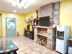 Η κουζίνα ή μικρή κουζίνα στο 吉住民宿