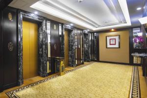 a hallway with yellow and black walls and a yellow carpet at Hotel Presidente Macau in Macau
