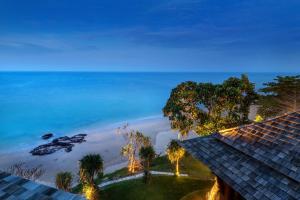 a view of the beach from a resort at Nirvana Beach Resort, Koh Lanta SHA Extra Plus in Ko Lanta