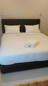 Postel nebo postele na pokoji v ubytování Suwannolhotel