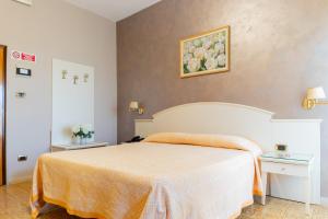 Postel nebo postele na pokoji v ubytování Hotel Riviera