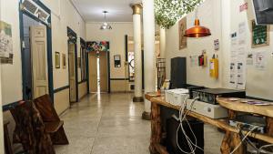 a room with a counter and a hallway at JEP Hostel in Medellín