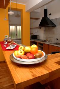 a plate of fruit on a table in a kitchen at A Caso in Avellino