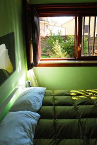 Ένα ή περισσότερα κρεβάτια σε δωμάτιο στο A Caso