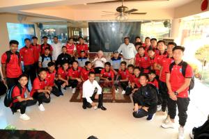 a group of men in red shirts posing for a picture at White Sands Resort & Spa in Varca +72 photos